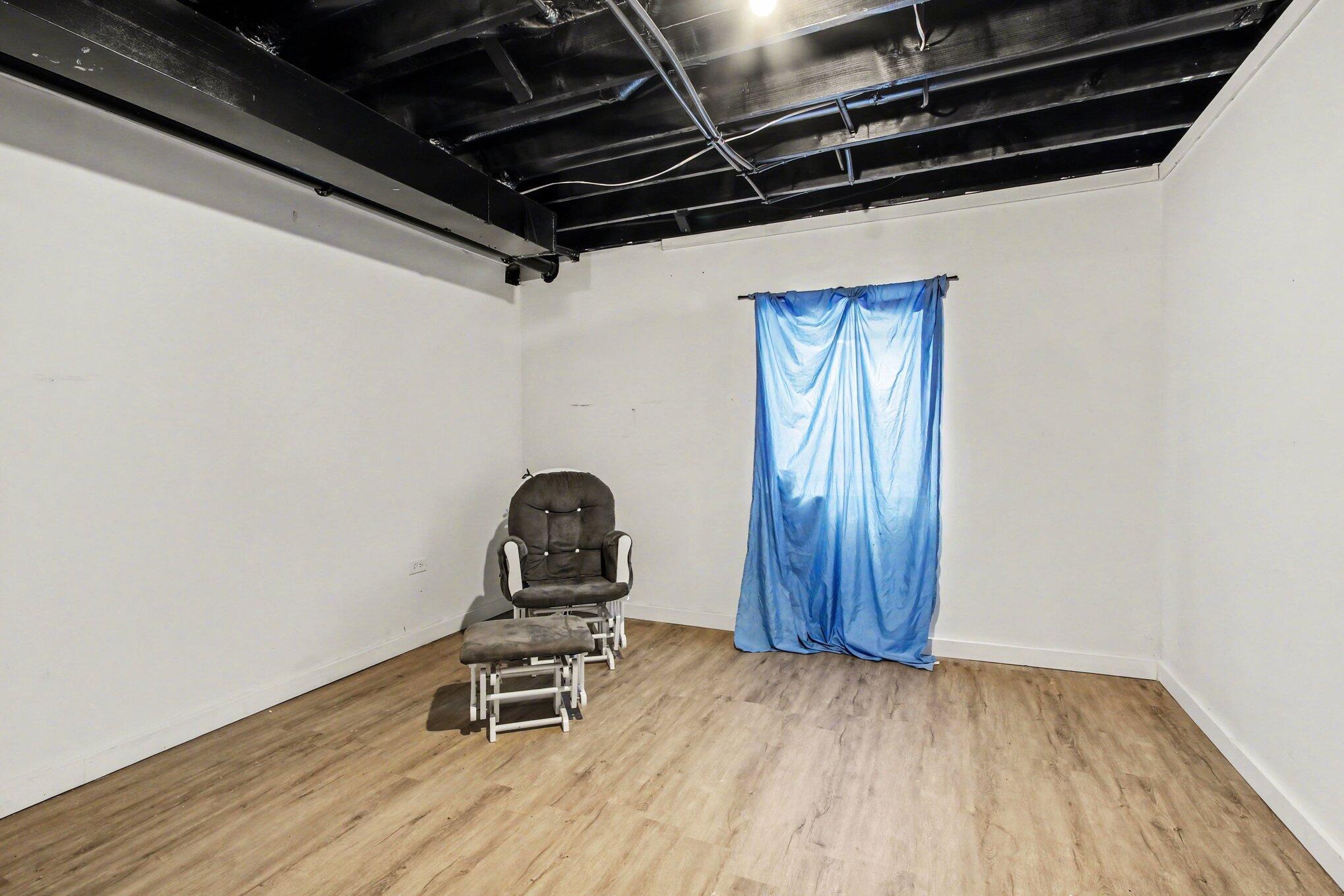 7480 Williams Street Merrillville, IN 46410 - Photo 35 of 49 a view of a room with wooden floor and furniture