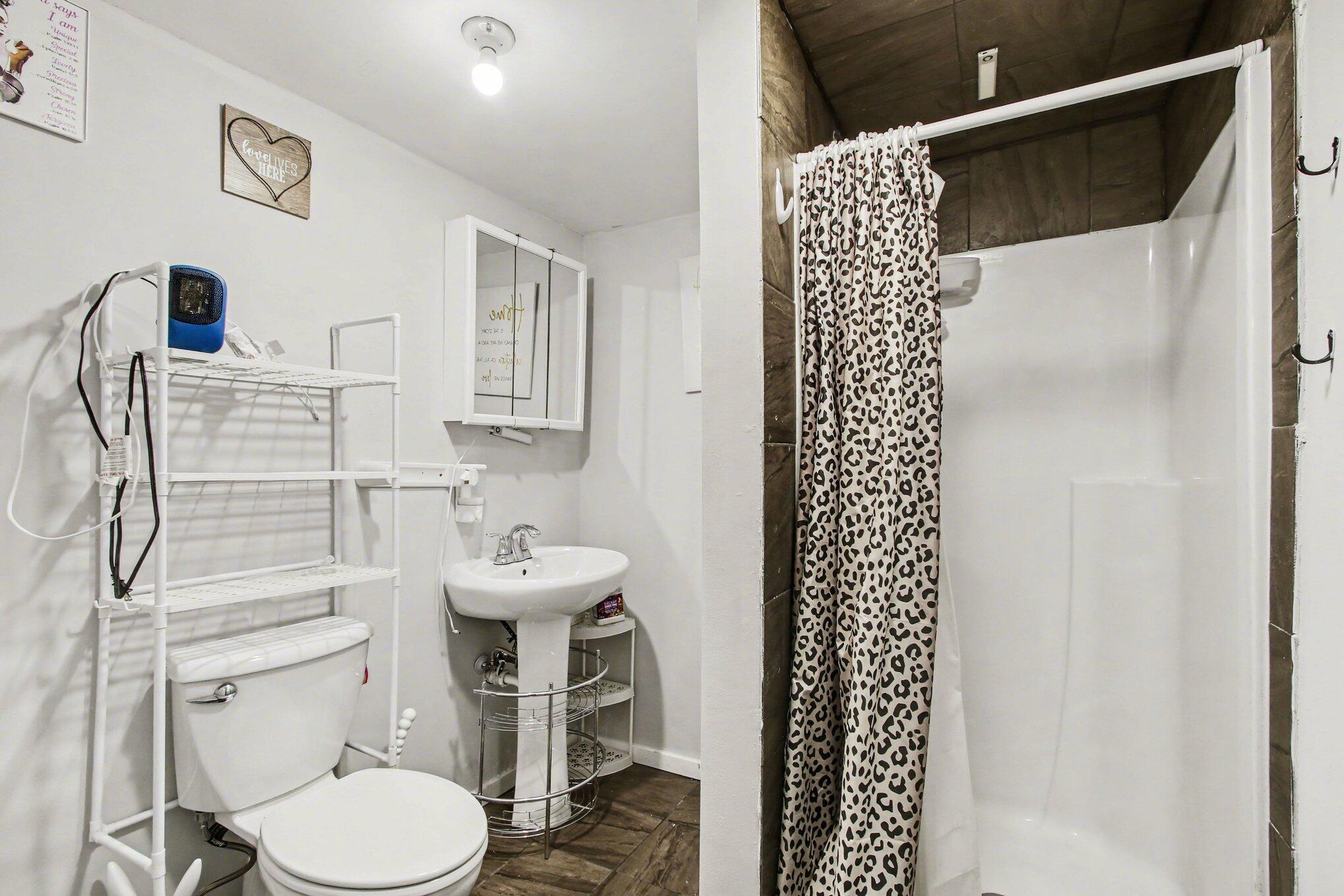 7480 Williams Street Merrillville, IN 46410 - Photo 38 of 49 a bathroom with a sink toilet and shower