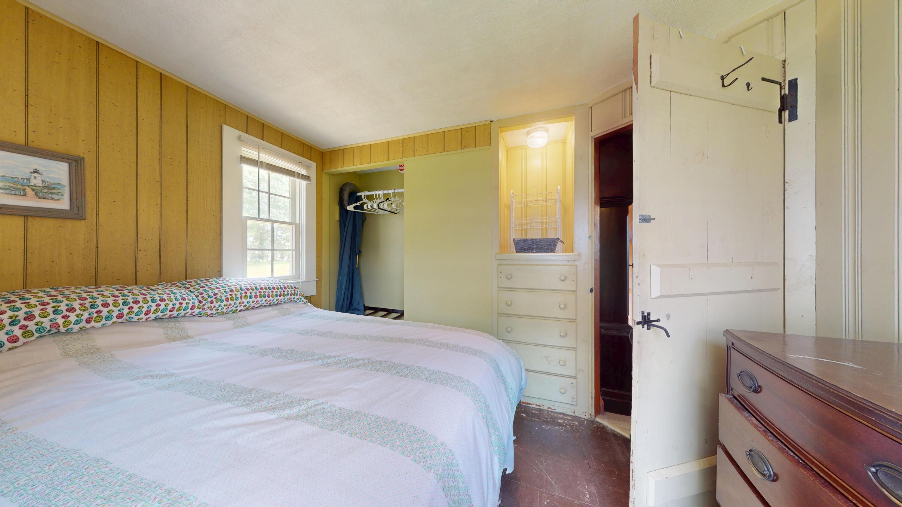 18 Myrtle Lane Dennis Port, MA 02639 - Photo 15 of 25 a bedroom with a bed and wooden floor