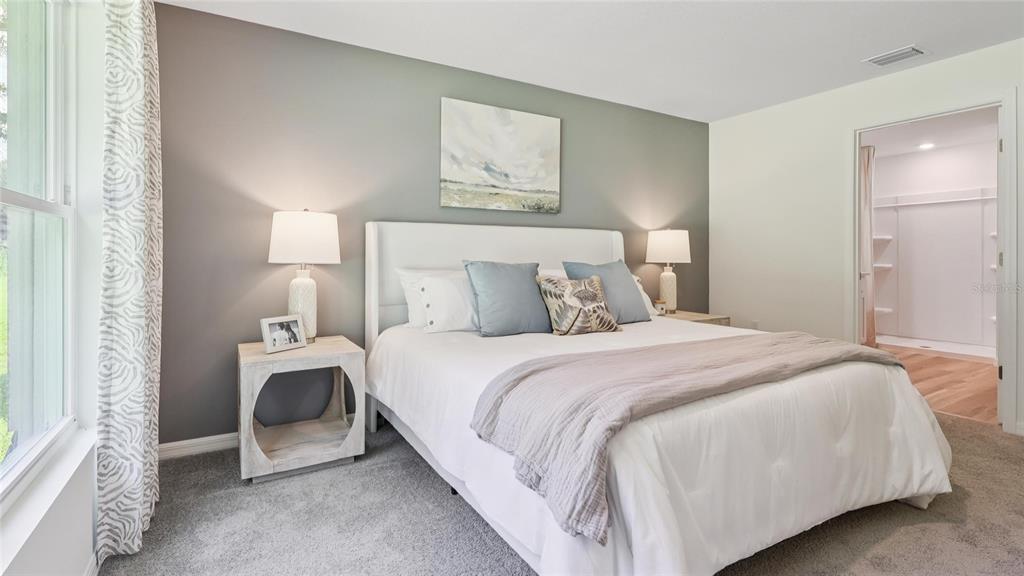 102 Paris Avenue Spring Hill, FL 34606 - Photo 12 of 21 a bedroom with a bed and a window