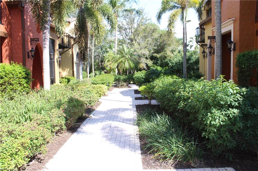 a view of a pathway with house on both side
