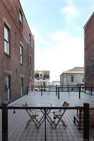 a kitchen with a refrigerator a sink and a stove top oven