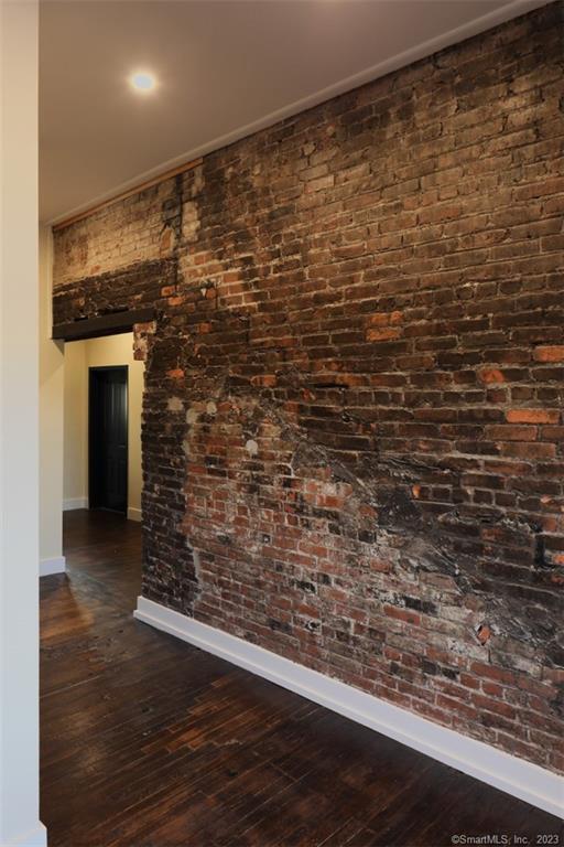 133 Bank Street, Unit 3H New London, CT 06320 - Photo 5 of 16 a view of water heater room with wooden floor