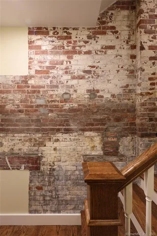 a kitchen with kitchen island a sink appliances and a counter top space
