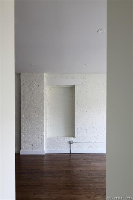 133 Bank Street, Unit 3H New London, CT 06320 - Photo 10 of 16 a view of an empty room with wooden floor