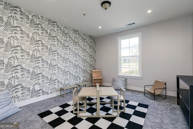 wooden floor in a livingroom with a rug
