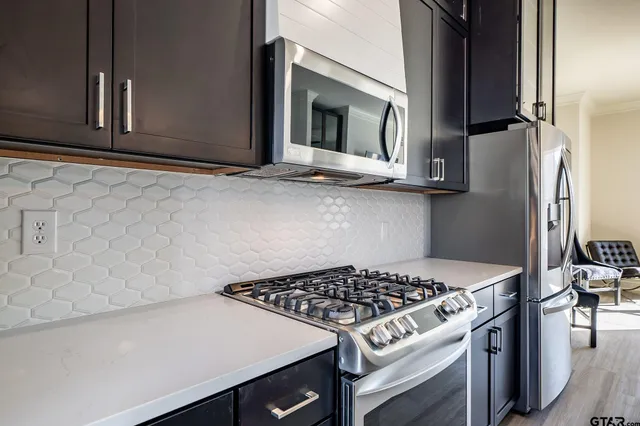 a kitchen with a stove and a microwave
