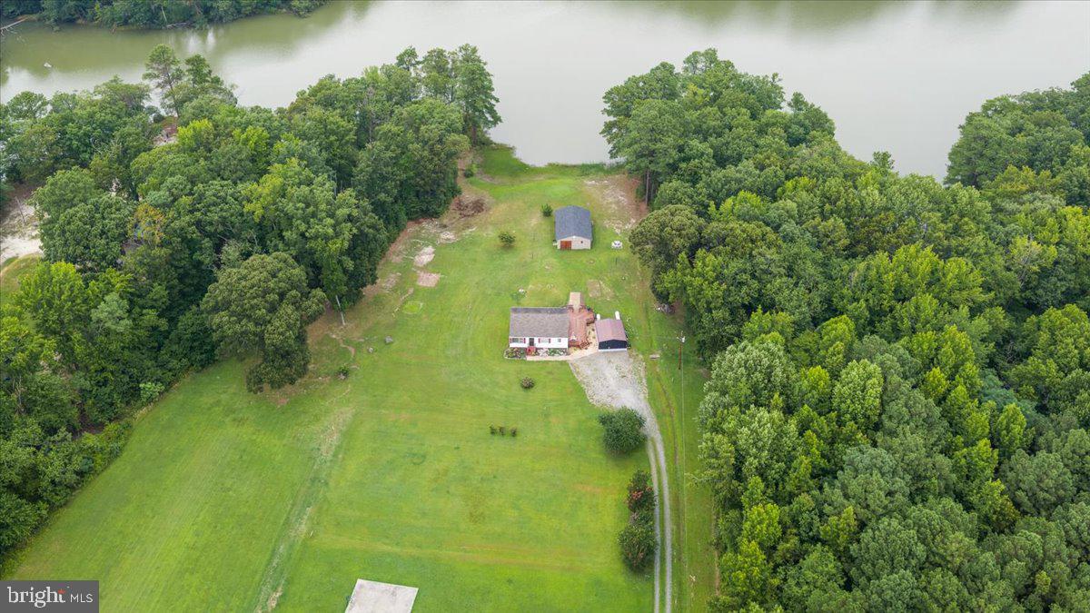 141 Raintree Lane Reedville, VA 22539 - Photo 7 of 86 Serene lakeside retreat surrounded by nature.