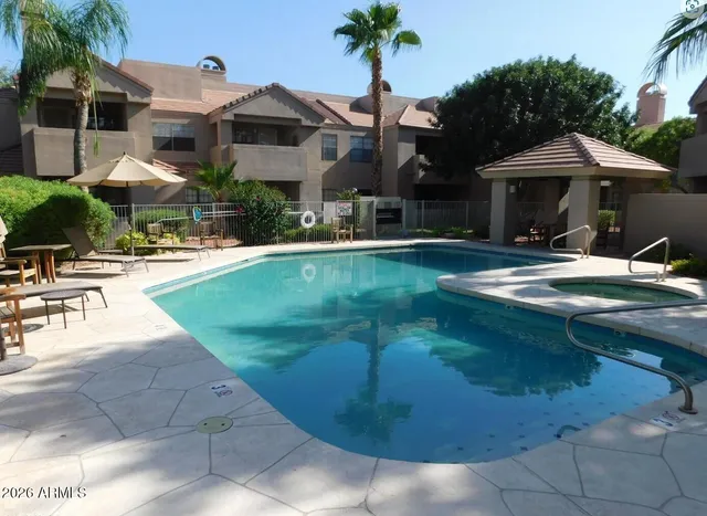 a front view of house with yard and outdoor seating