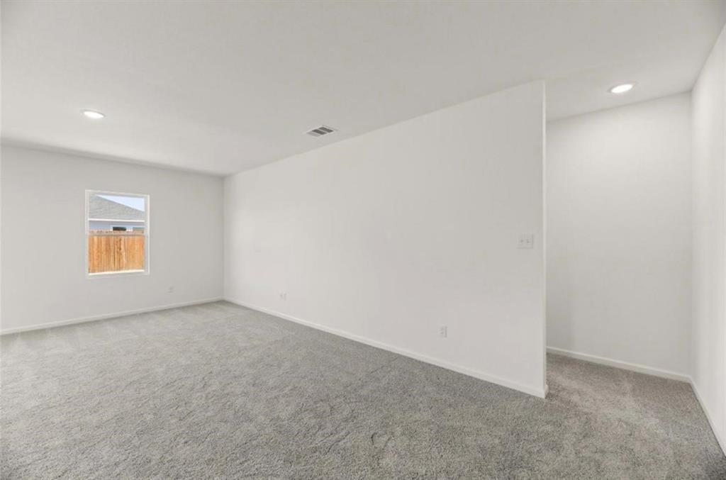 10308 Holy Cross Lane Crowley, TX 76036 - Photo 10 of 27 an empty room with windows