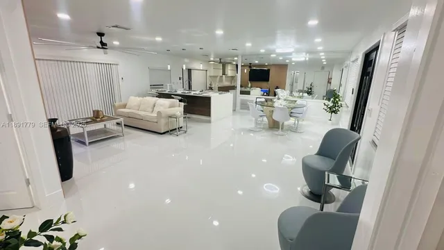 a living room with furniture and a large mirror