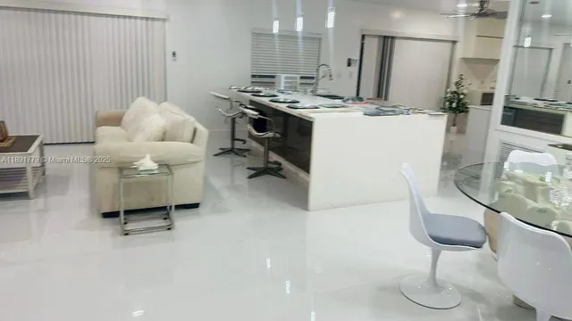 a kitchen with a sink appliances and cabinets