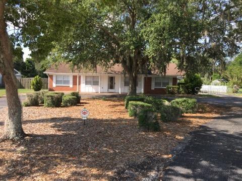 1786 Neptune Road Kissimmee, FL 34744 - Photo 1 of 1 a front view of a house with a yard