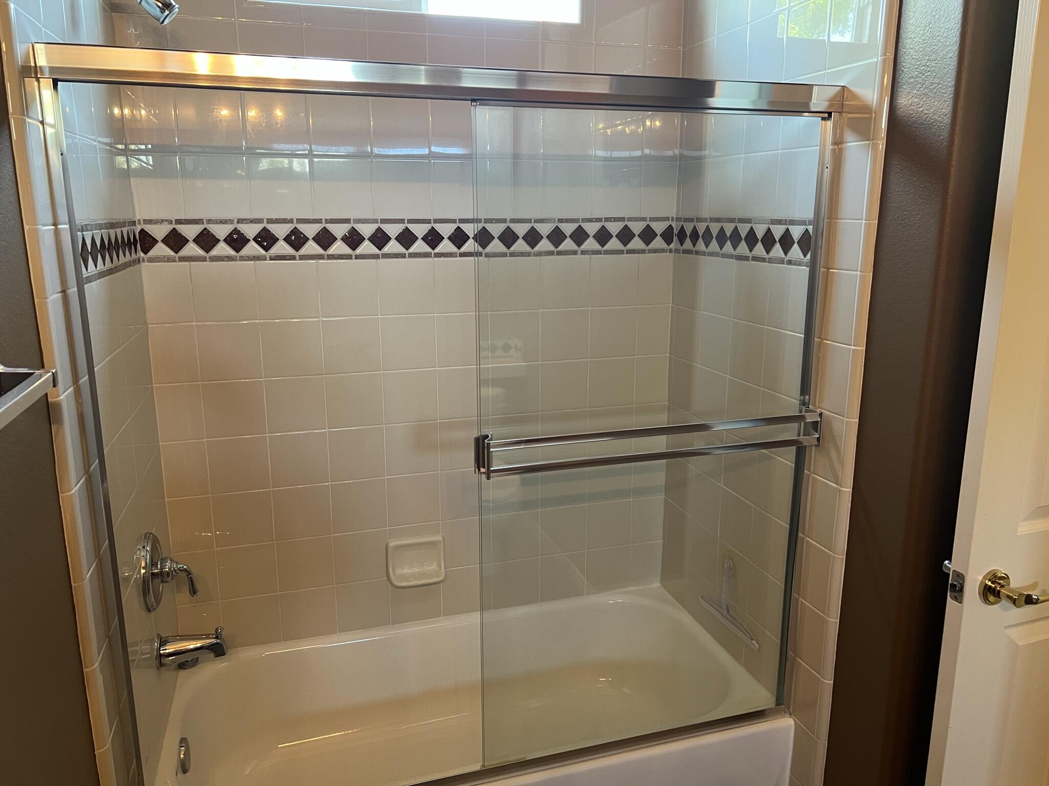 59 Shoreline Drive Rancho Mirage, CA 92270 - Photo 12 of 56 a bathroom with a glass shower door