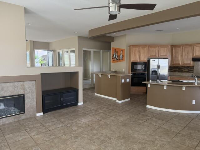 59 Shoreline Drive Rancho Mirage, CA 92270 - Photo 18 of 56 a kitchen with refrigerator and window