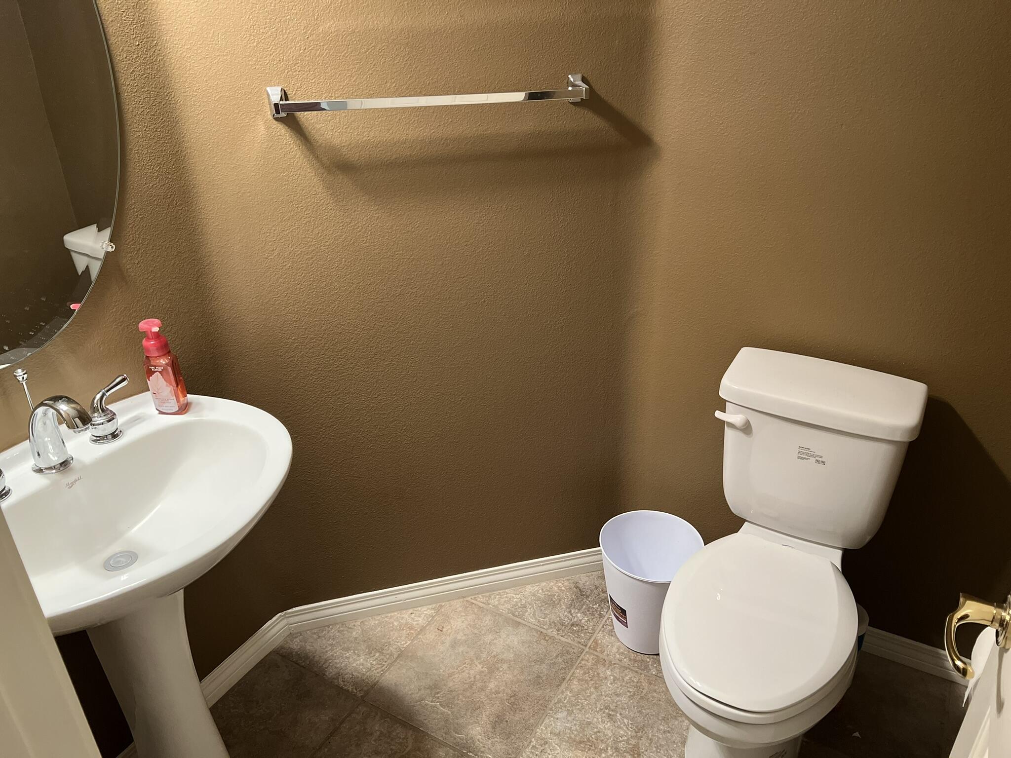 59 Shoreline Drive Rancho Mirage, CA 92270 - Photo 27 of 56 a bathroom with a toilet a sink and a mirror