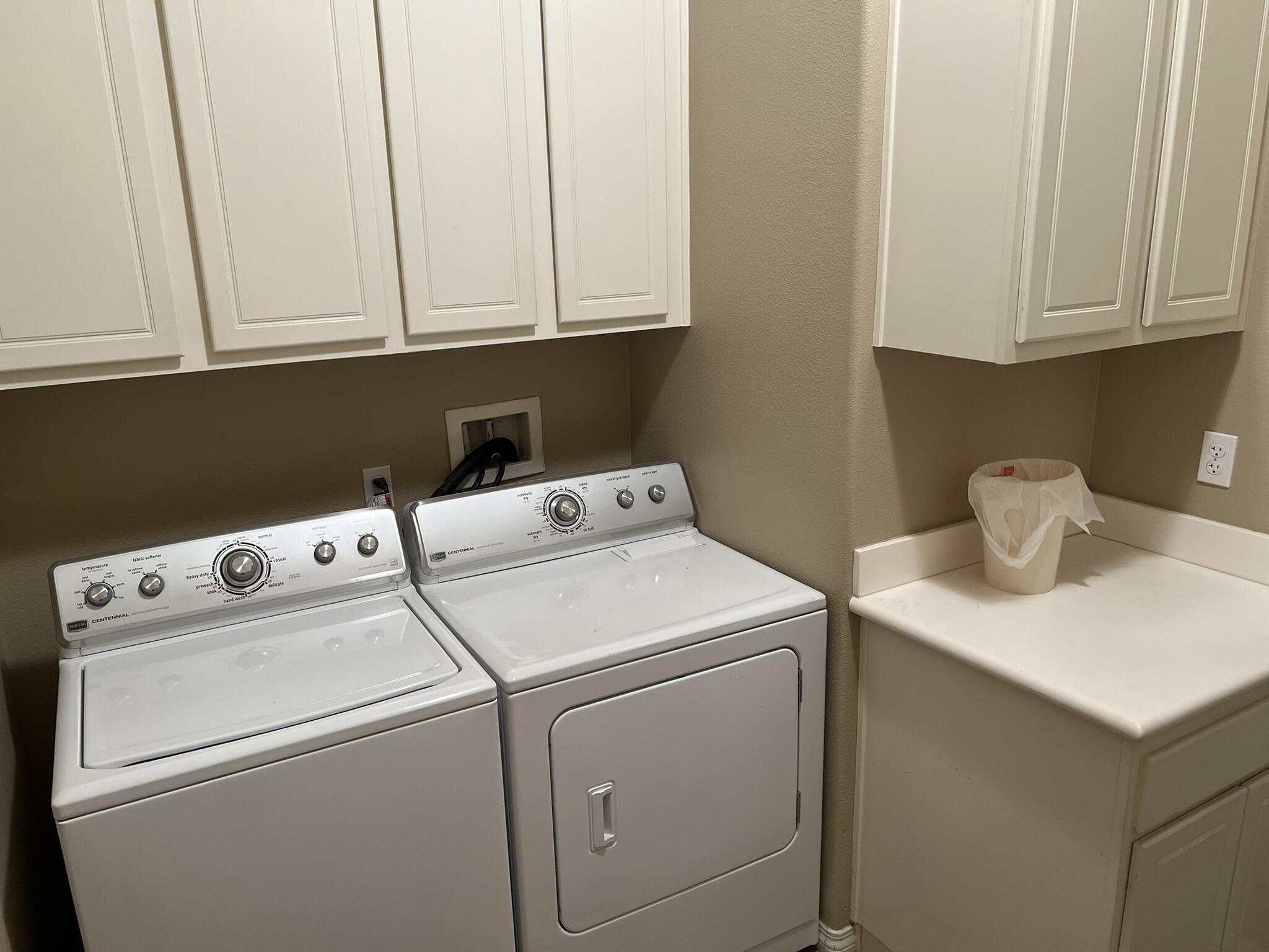 59 Shoreline Drive Rancho Mirage, CA 92270 - Photo 39 of 56 a utility room with dryer and washer