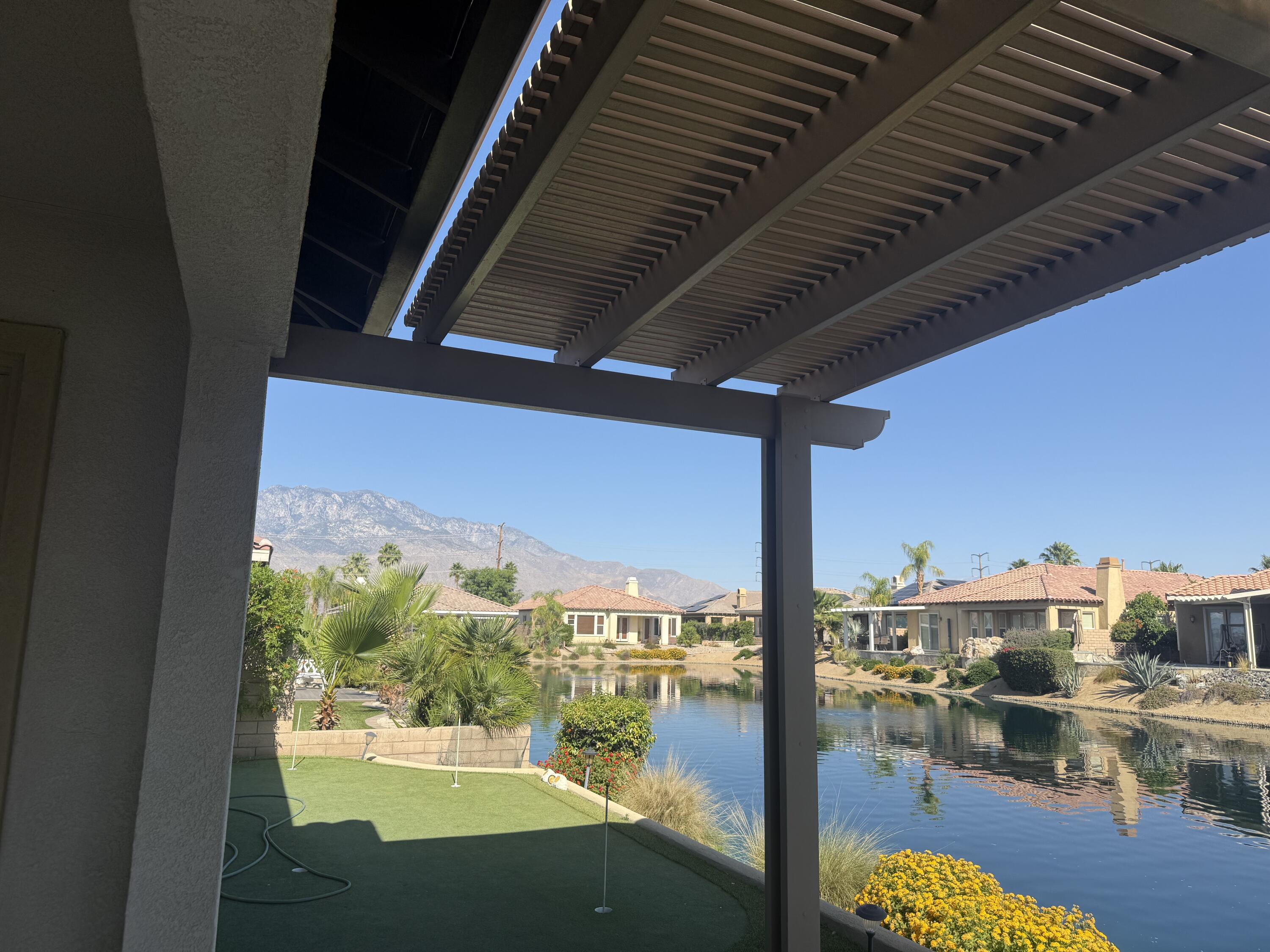 59 Shoreline Drive Rancho Mirage, CA 92270 - Photo 45 of 56 a view of a balcony with yard