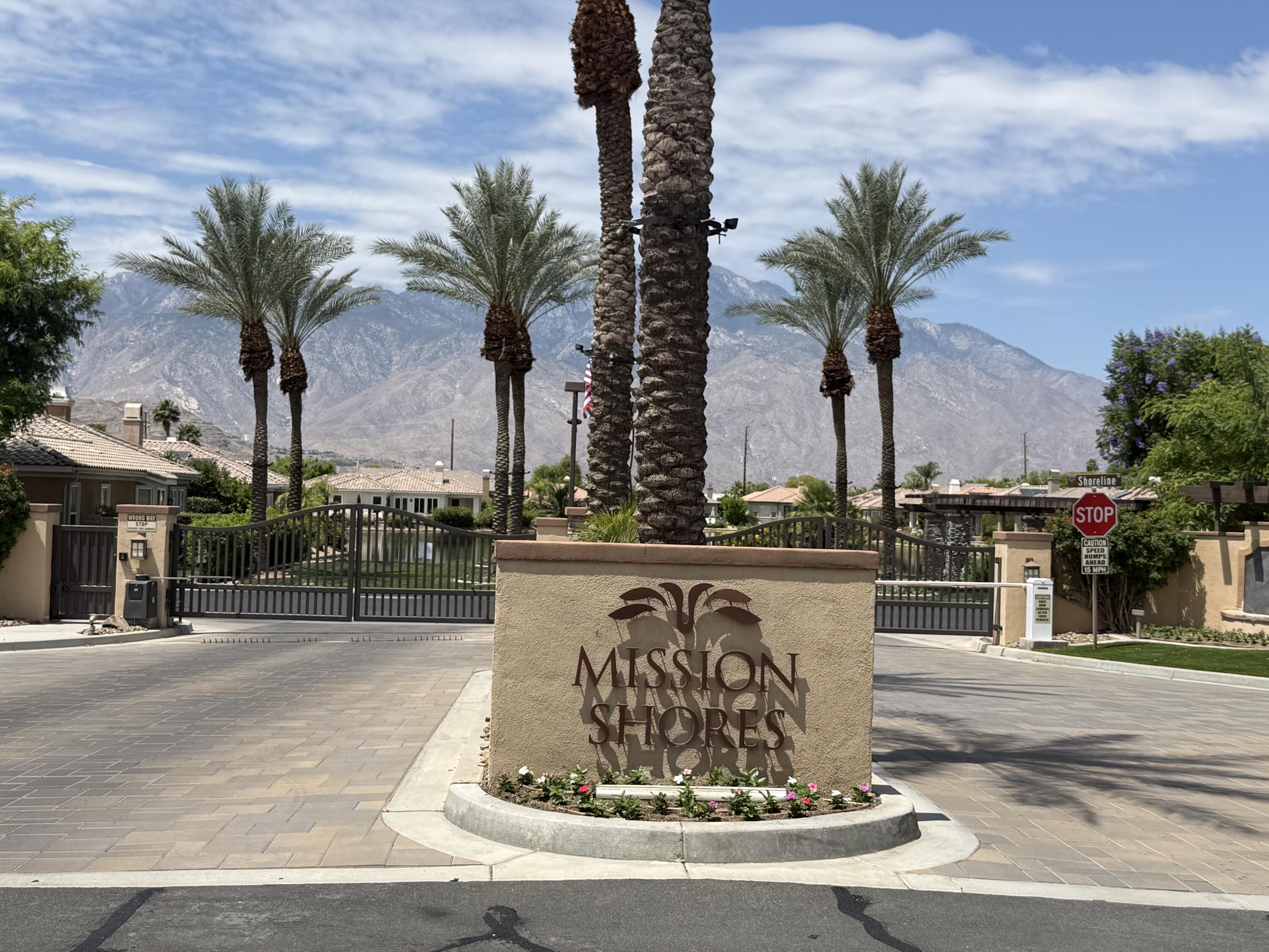 59 Shoreline Drive Rancho Mirage, CA 92270 - Photo 55 of 56 a view of a water fountain and palm trees
