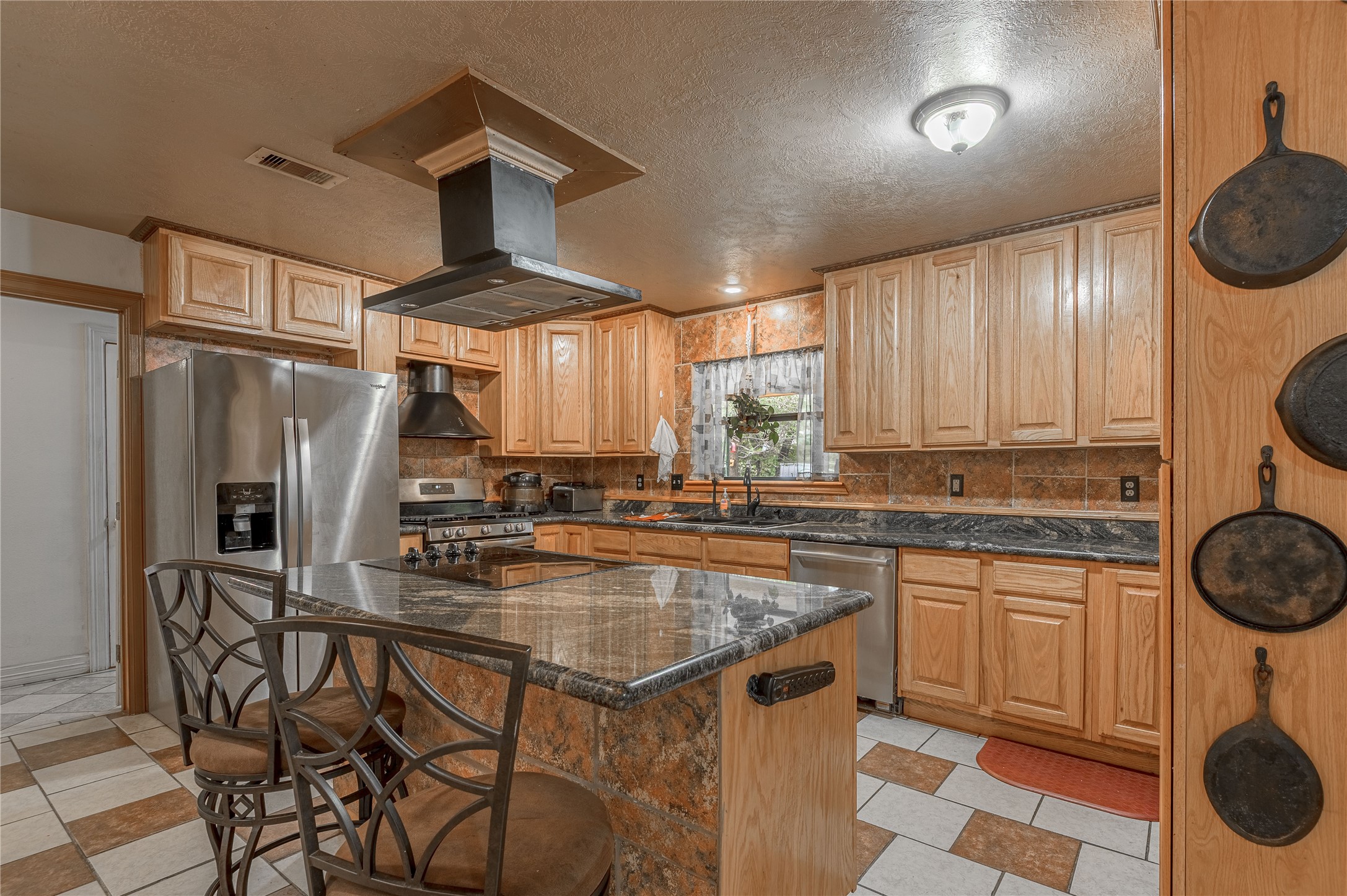 47-57 Stage Coach Road Coldspring, TX 77331 - Photo 12 of 50 a kitchen with stainless steel appliances granite countertop a stove a sink and a refrigerator