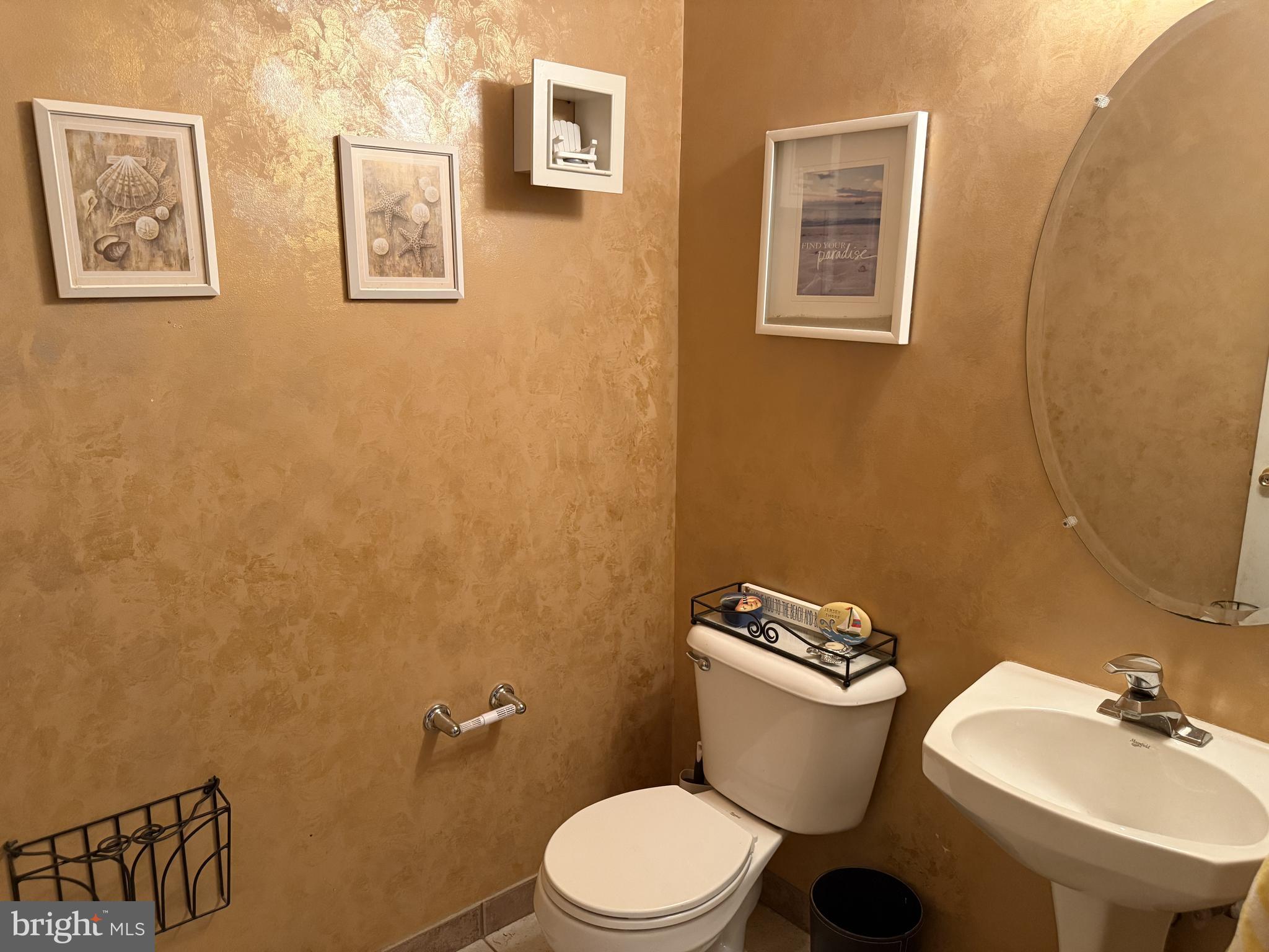 135 Juniper Lane Swedesboro, NJ 08085 - Photo 16 of 40 a white toilet sitting next to a bathroom sink