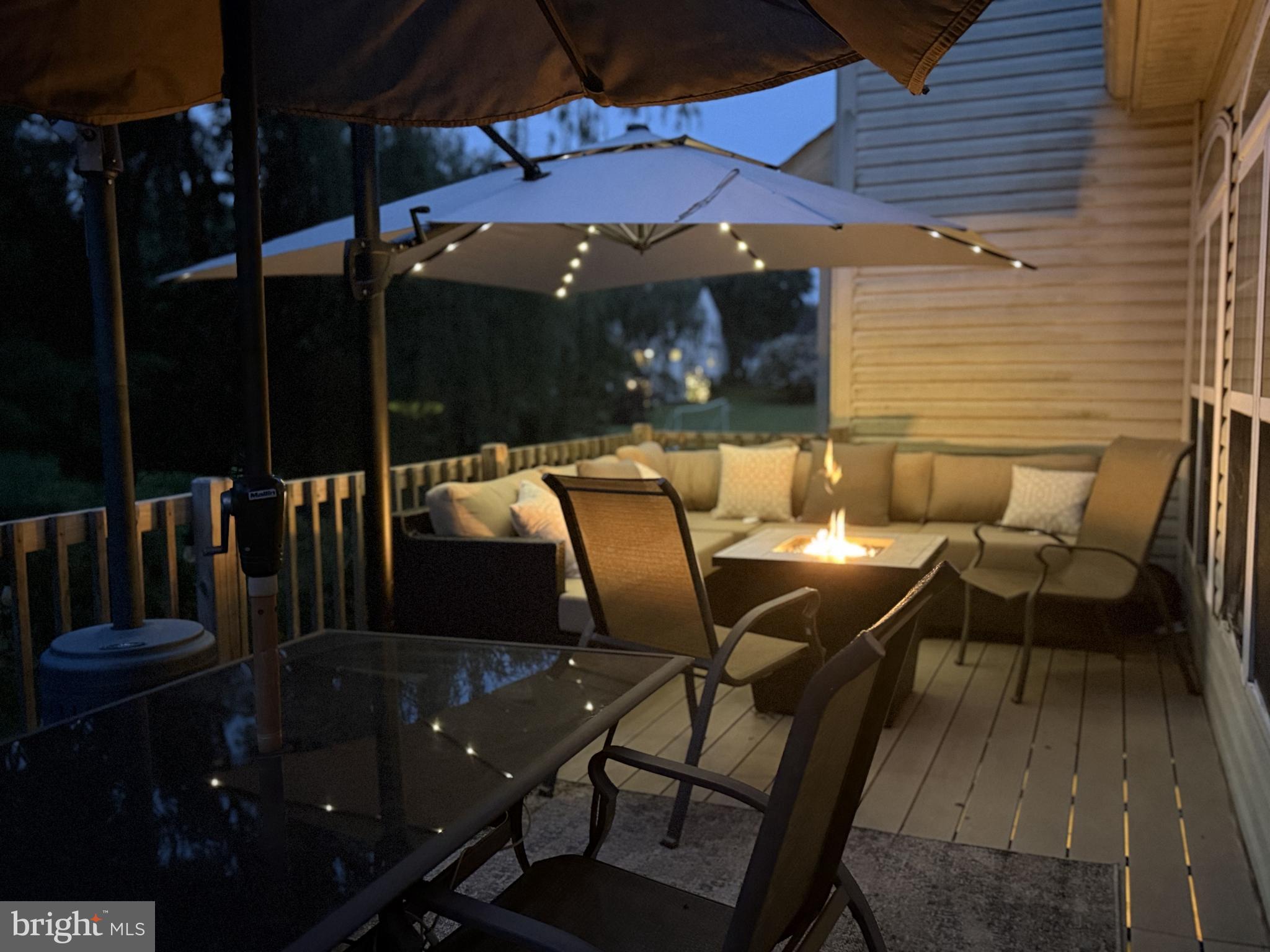135 Juniper Lane Swedesboro, NJ 08085 - Photo 19 of 40 a view of a patio with table and chairs with wooden floor