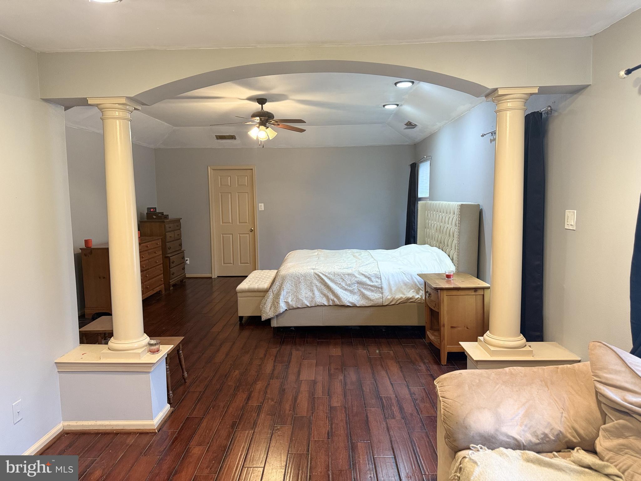 135 Juniper Lane Swedesboro, NJ 08085 - Photo 25 of 40 a spacious bedroom with a bed and wooden floor