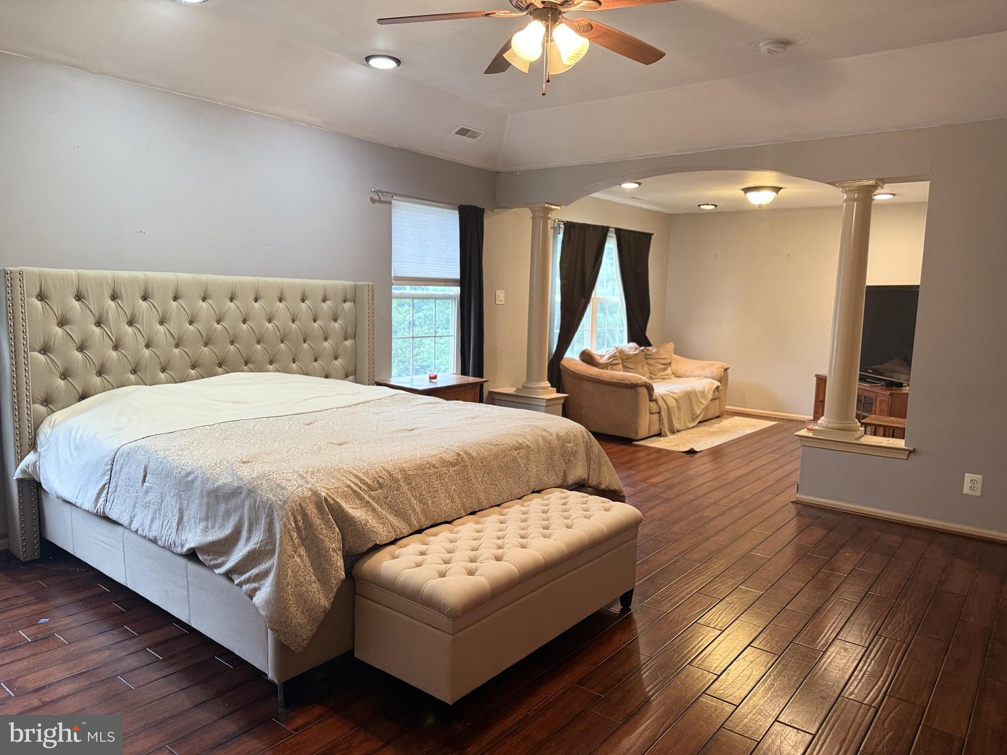 135 Juniper Lane Swedesboro, NJ 08085 - Photo 26 of 40 a spacious bedroom with a bed couch and a large window