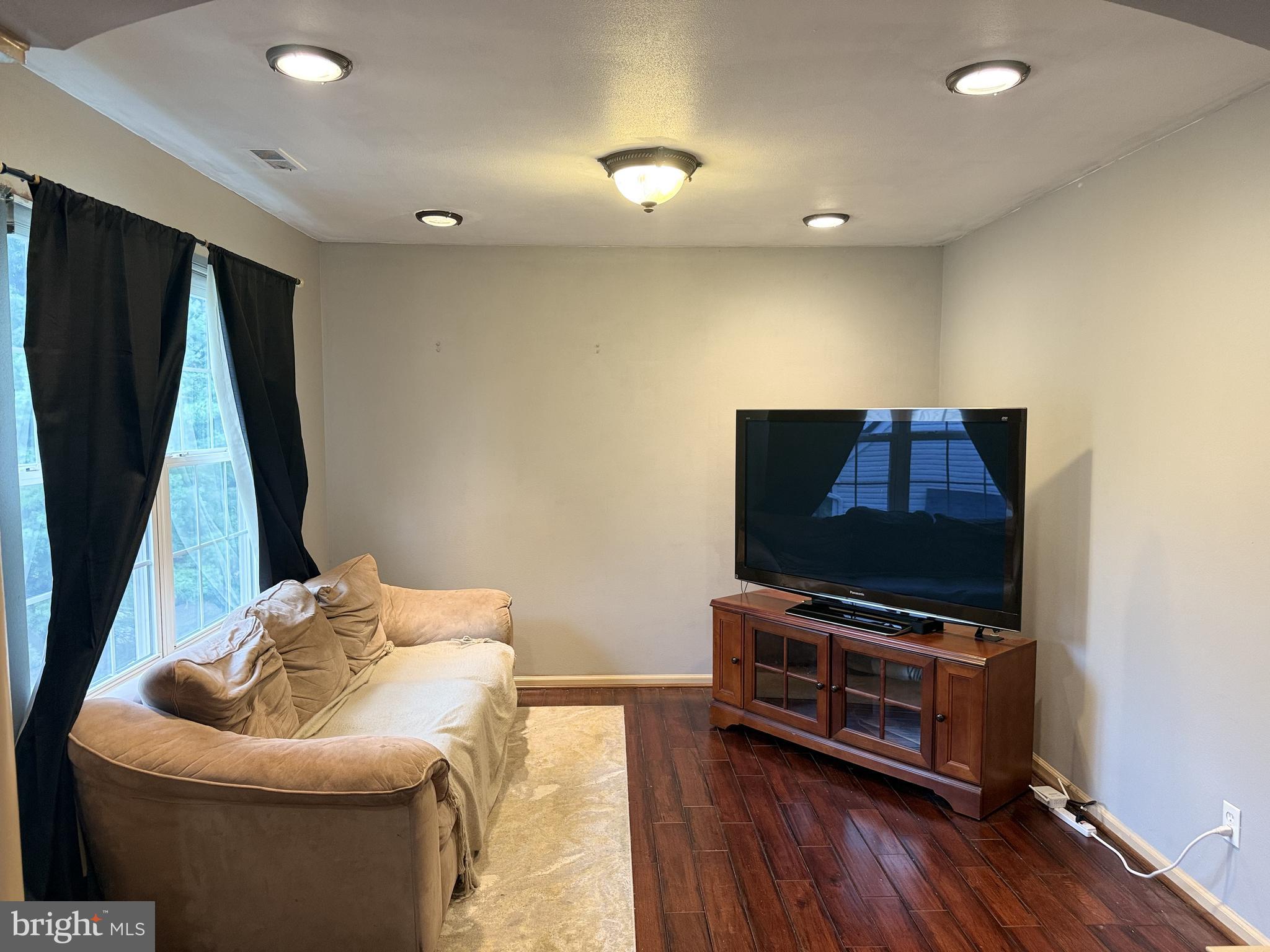 135 Juniper Lane Swedesboro, NJ 08085 - Photo 27 of 40 a living room with furniture and a flat screen tv