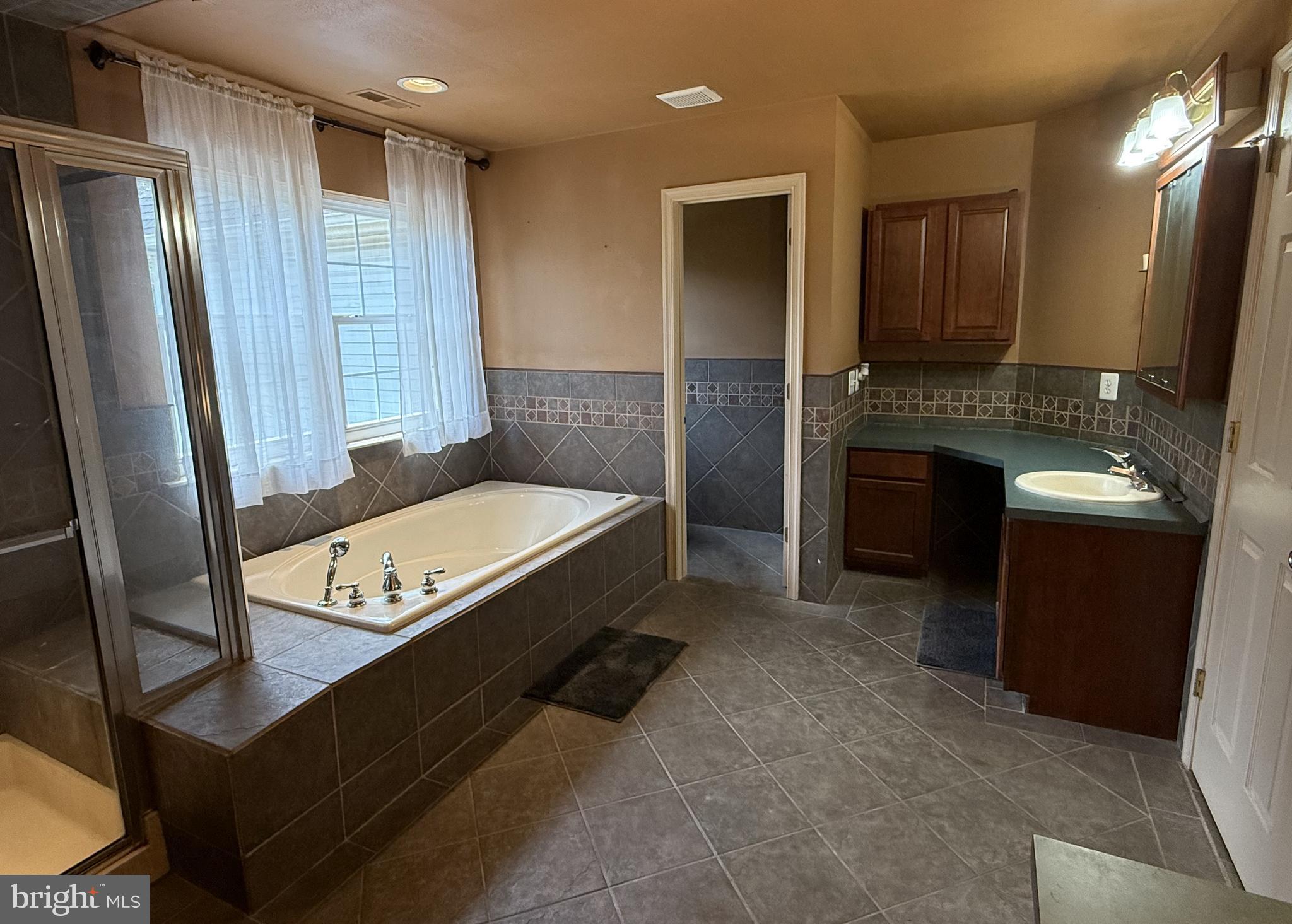 135 Juniper Lane Swedesboro, NJ 08085 - Photo 28 of 40 a spacious bathroom with a double vanity sink and a mirror