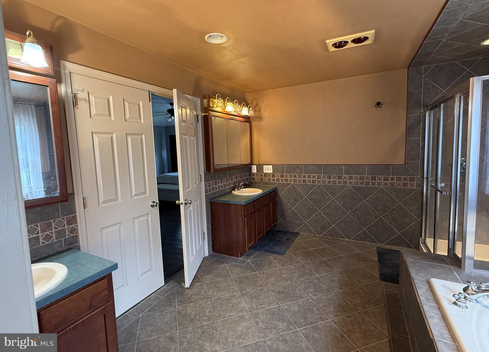 135 Juniper Lane Swedesboro, NJ 08085 - Photo 29 of 40 a bathroom with a sink a toilet and shower