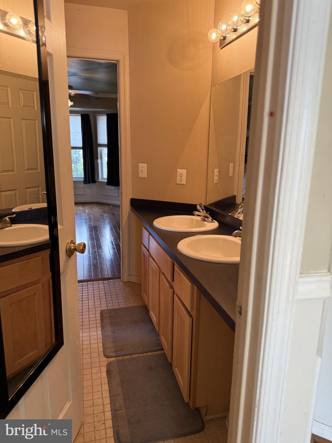 135 Juniper Lane Swedesboro, NJ 08085 - Photo 34 of 40 a bathroom with a granite countertop sink and a mirror