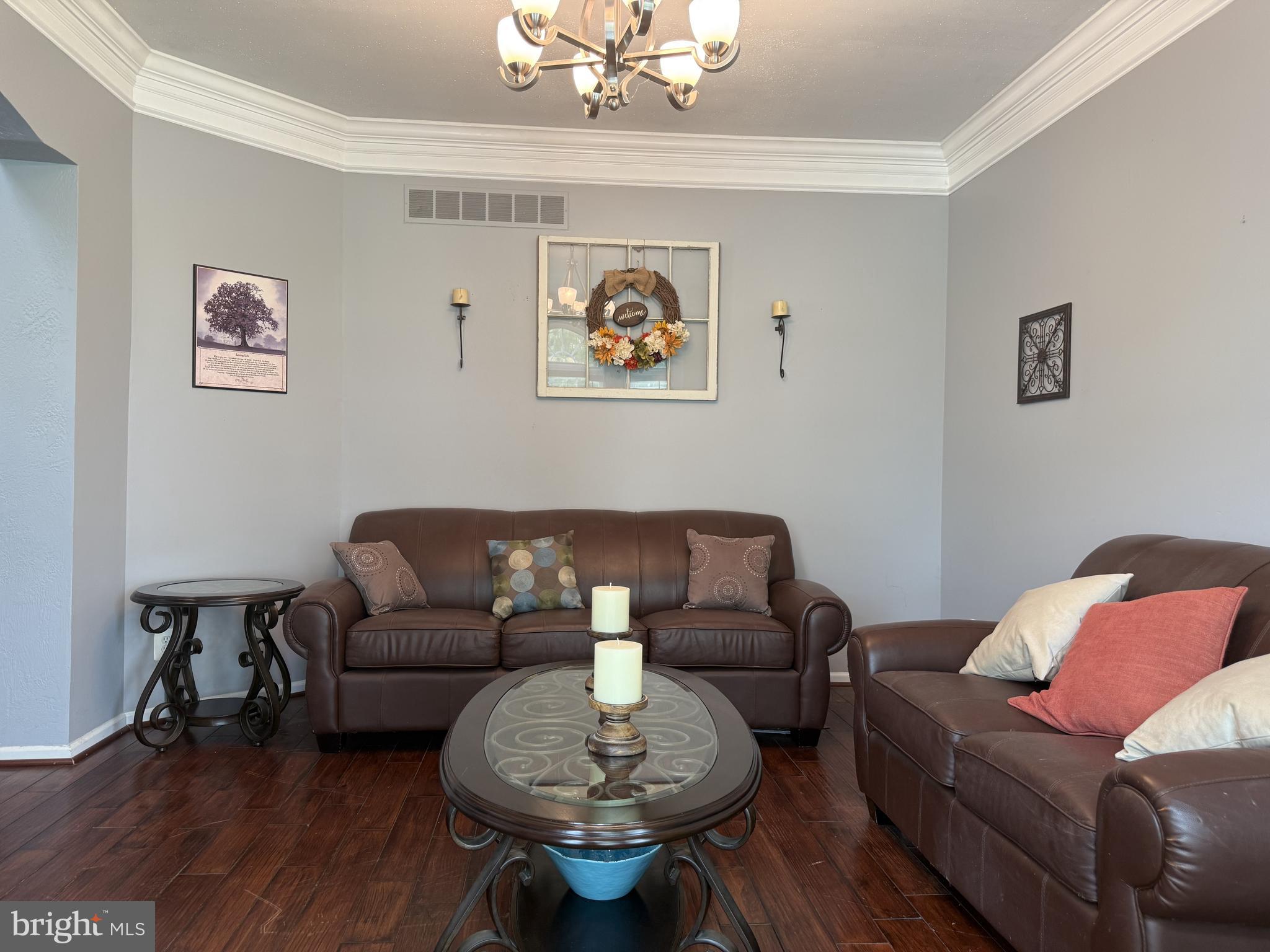 135 Juniper Lane Swedesboro, NJ 08085 - Photo 10 of 40 a living room with furniture and a chandelier