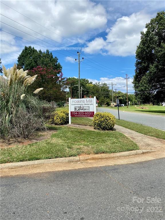 201 South Hoskins Road, Unit 326 Charlotte, NC 28208 - Photo 18 of 18 a sign on the side of a road
