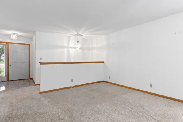 an empty room with wooden floor