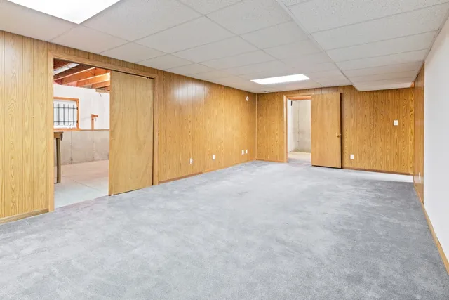 a view of an empty room with glass door