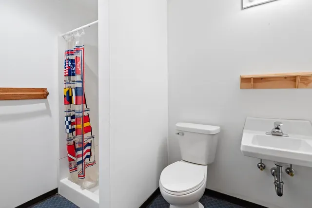 a bathroom with a toilet and a sink