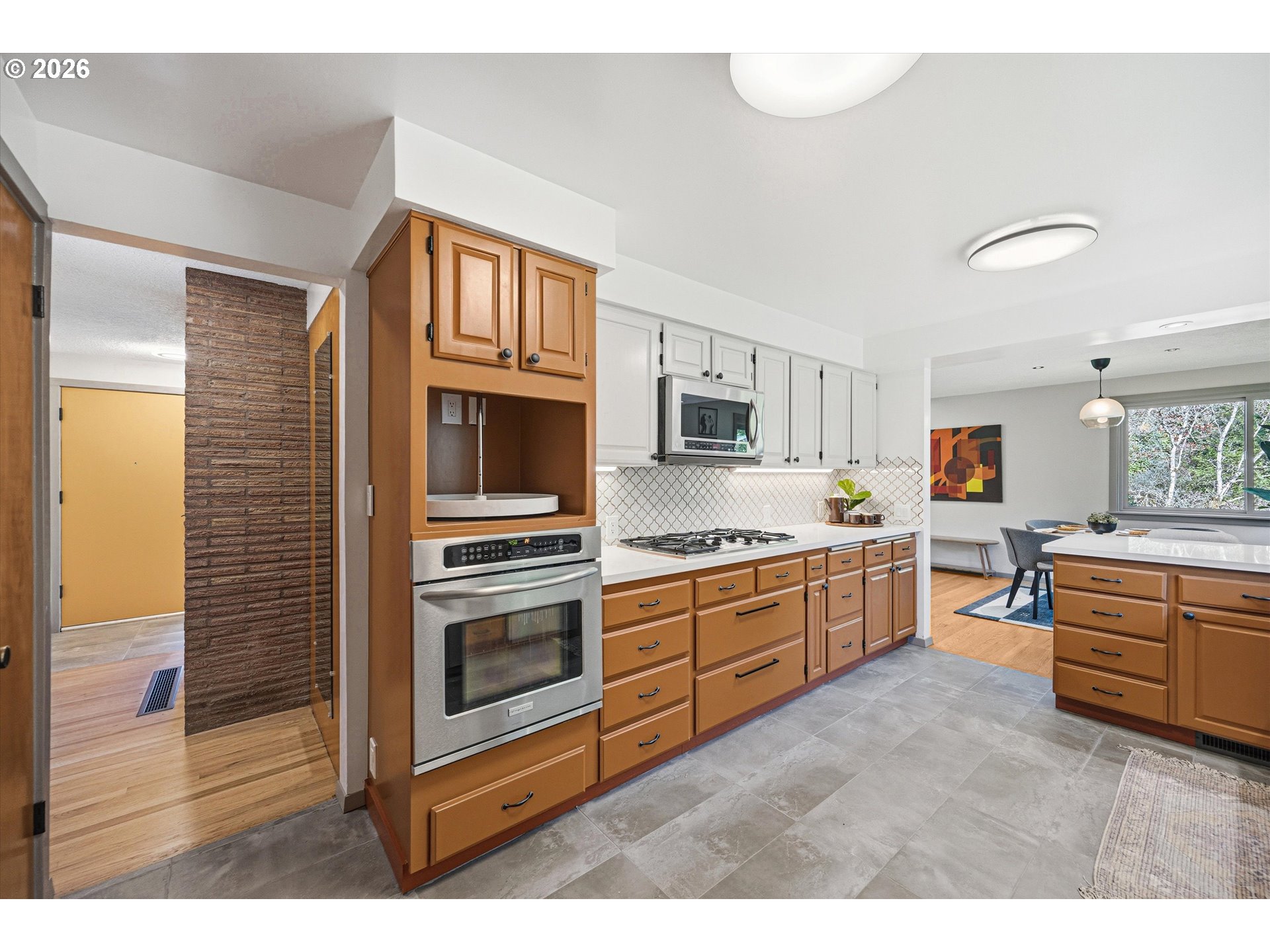 12802 Southeast Knapp Street Portland, OR 97236 - Photo 17 of 48 a kitchen with stainless steel appliances granite countertop a stove and cabinets