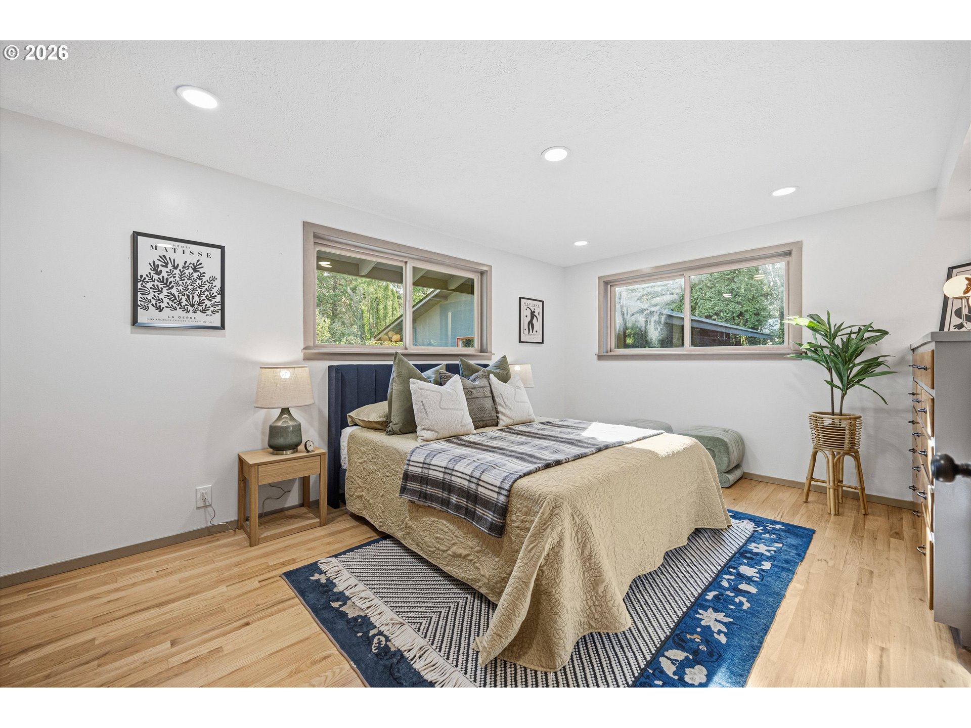 12802 Southeast Knapp Street Portland, OR 97236 - Photo 20 of 48 a bed room with a bed window and a chair