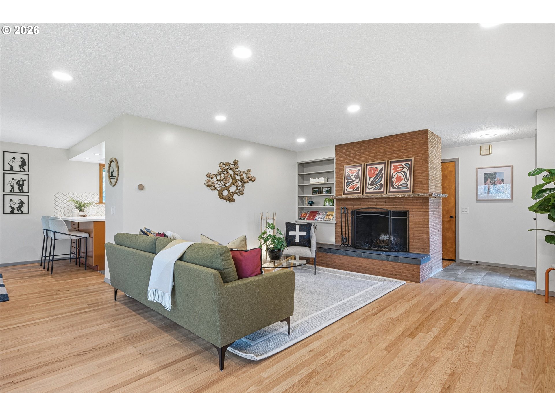 12802 Southeast Knapp Street Portland, OR 97236 - Photo 2 of 48 a living room with furniture and a fireplace