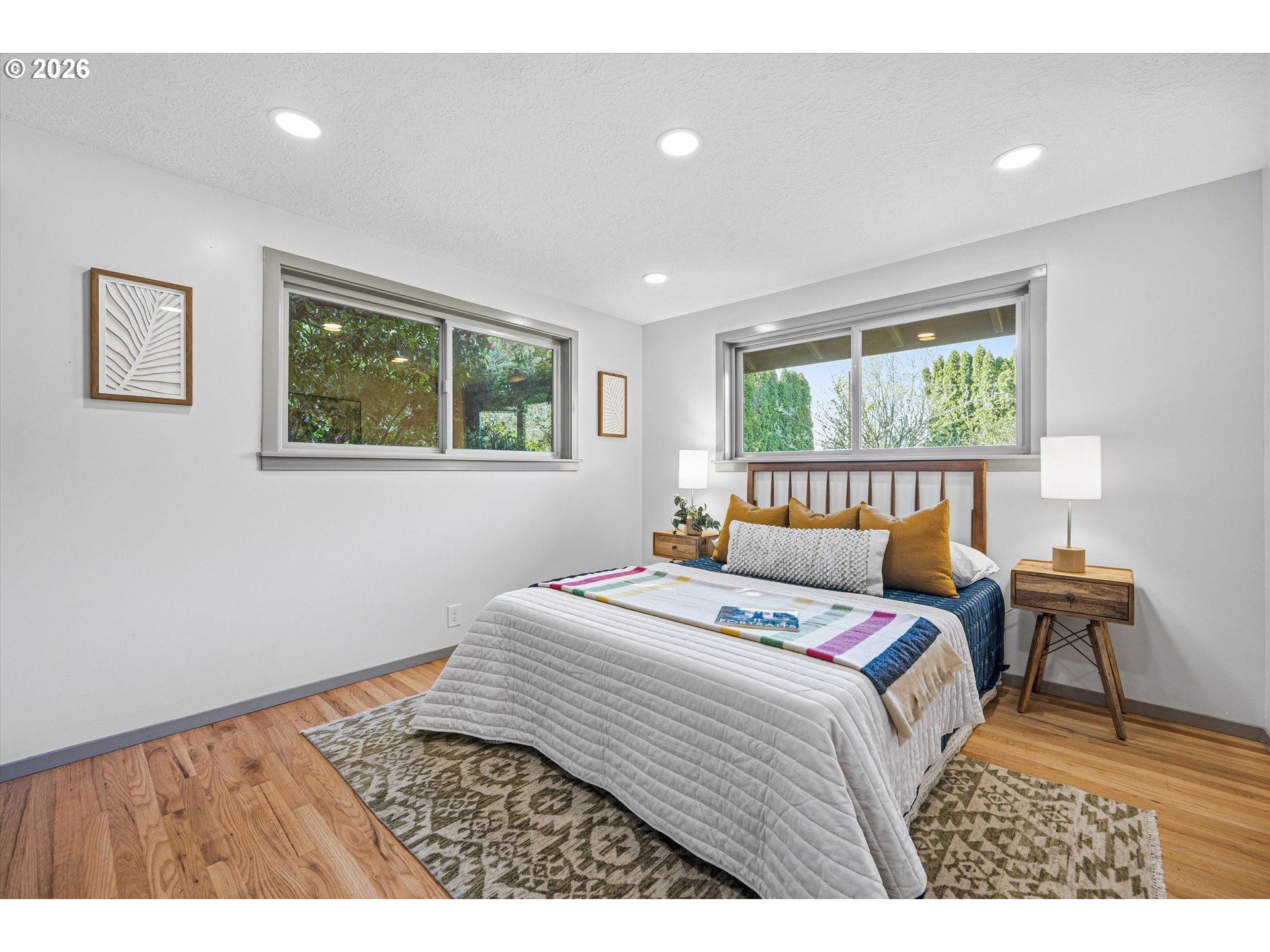 12802 Southeast Knapp Street Portland, OR 97236 - Photo 24 of 48 a bedroom with a bed window and table