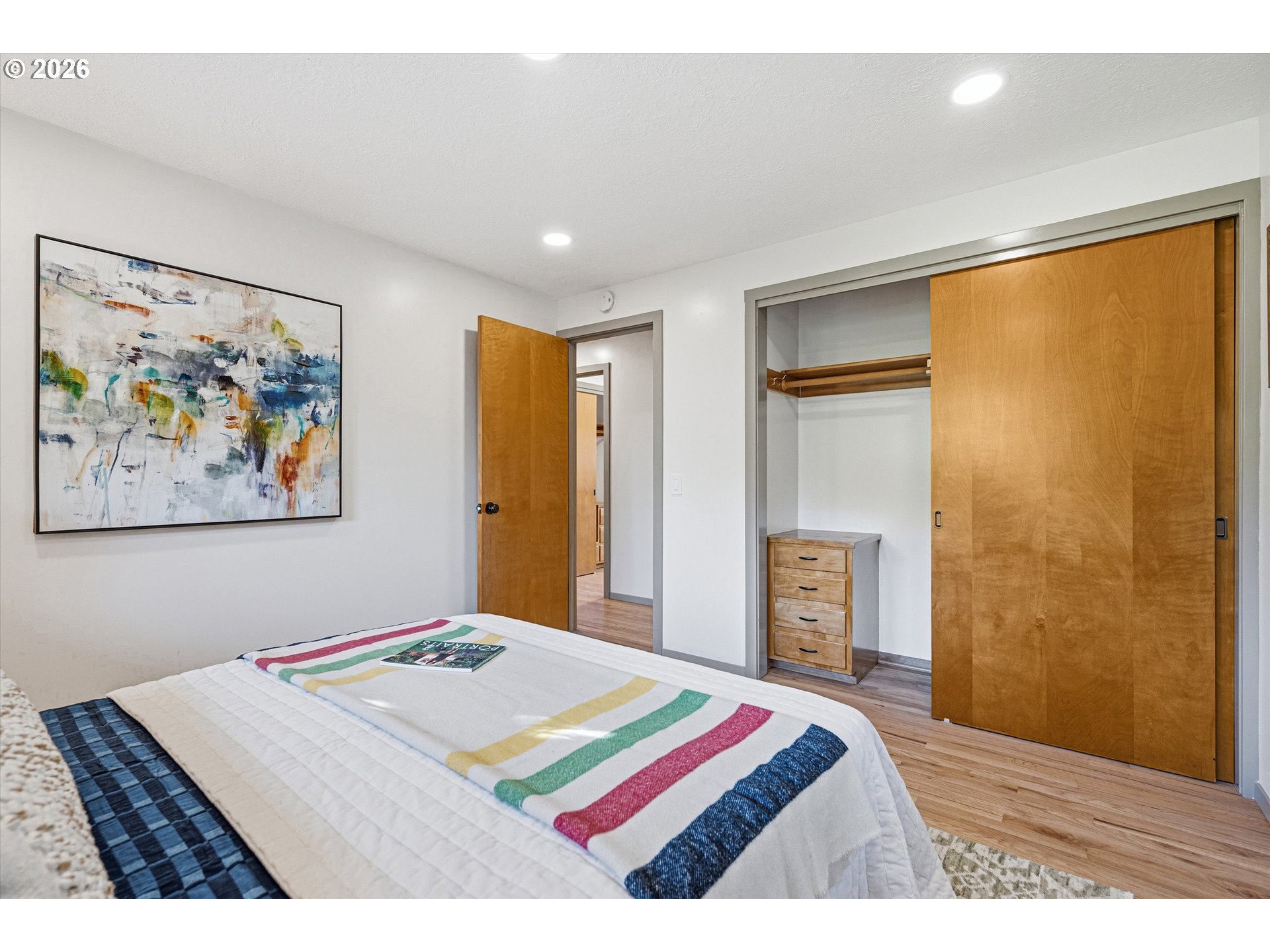 12802 Southeast Knapp Street Portland, OR 97236 - Photo 25 of 48 a bedroom with a bed and a painting on the wall