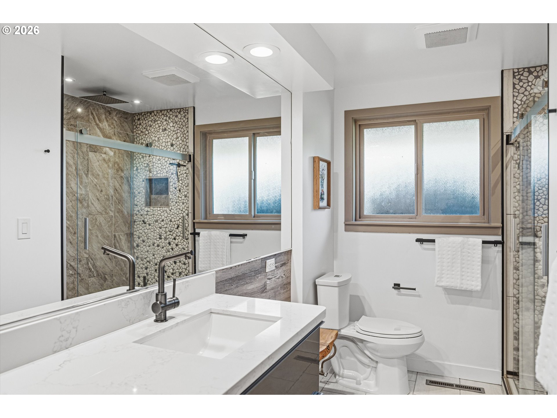 12802 Southeast Knapp Street Portland, OR 97236 - Photo 26 of 48 a bathroom with a sink a toilet and shower