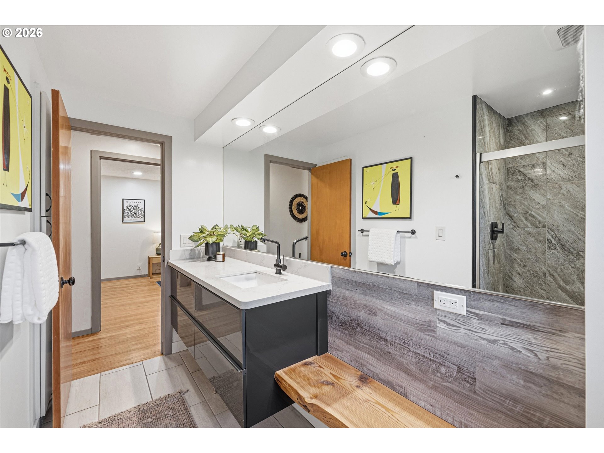 12802 Southeast Knapp Street Portland, OR 97236 - Photo 27 of 48 a bathroom with a sink a mirror and a shower