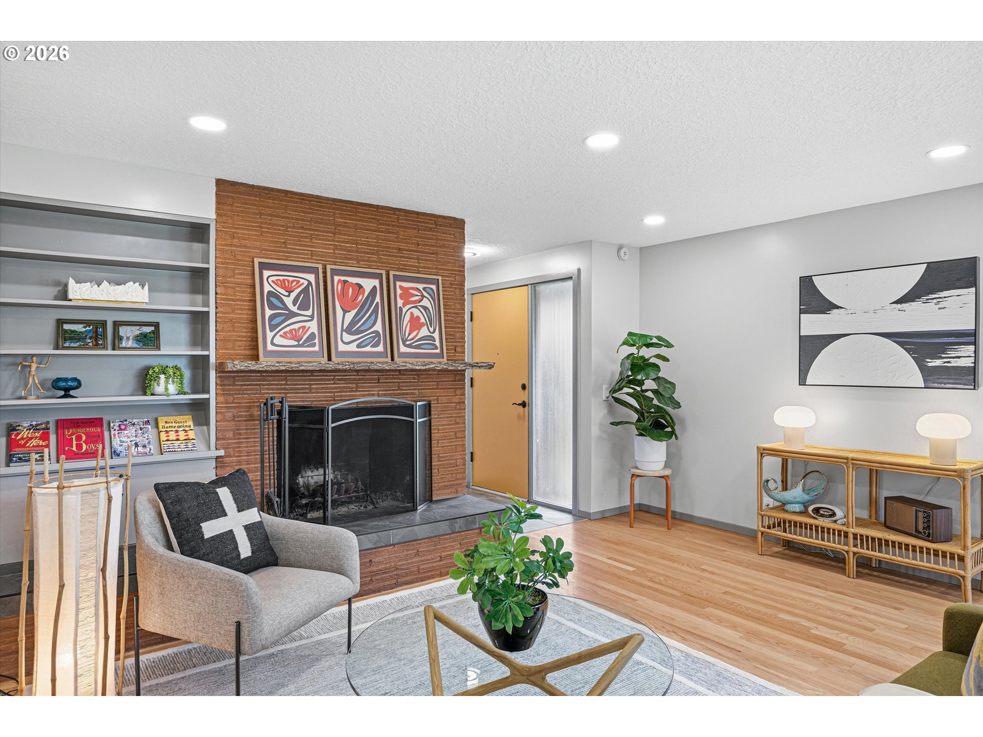 12802 Southeast Knapp Street Portland, OR 97236 - Photo 3 of 48 a living room with furniture and a fireplace
