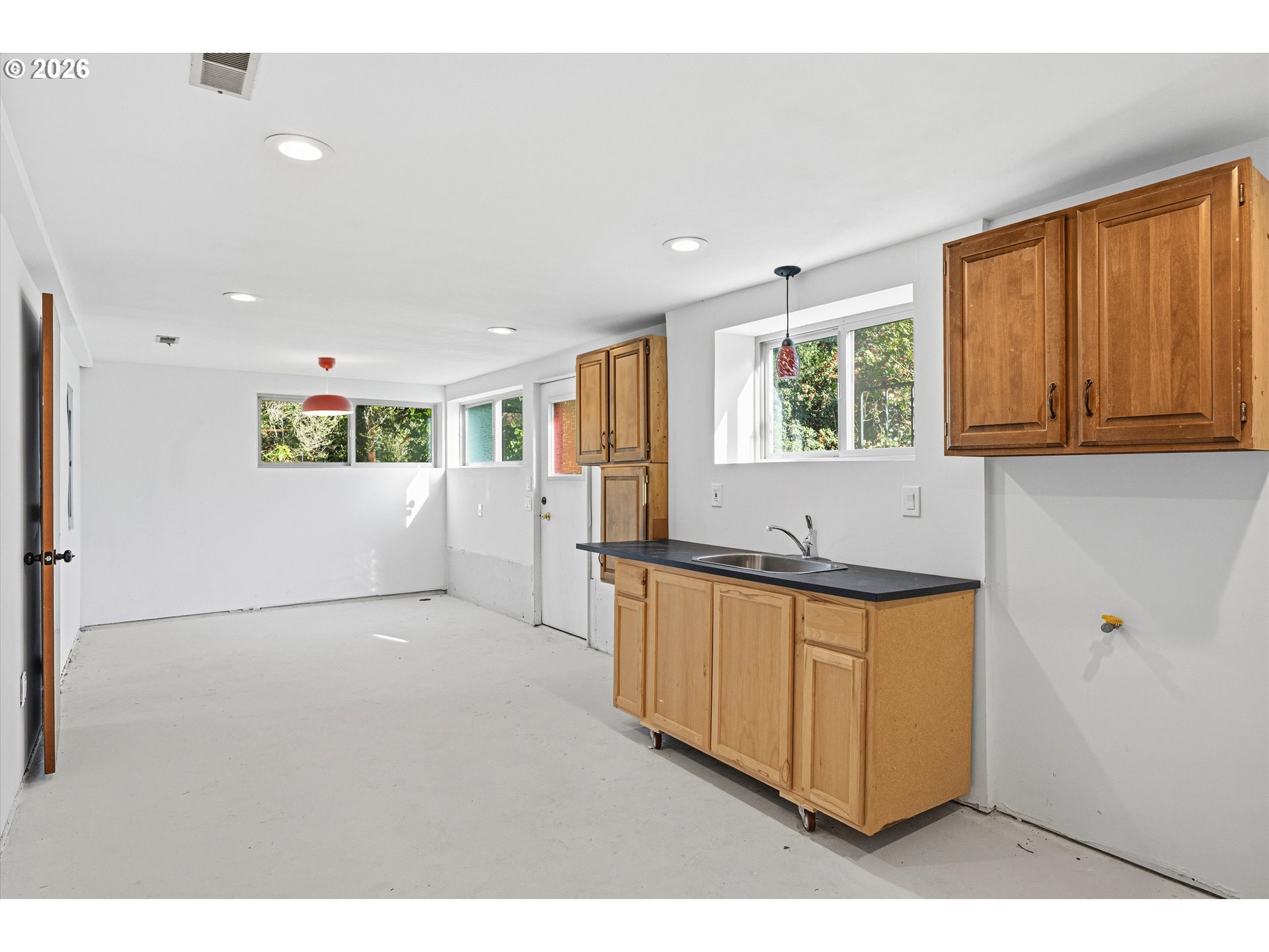 12802 Southeast Knapp Street Portland, OR 97236 - Photo 36 of 48 a view of kitchen with stainless steel appliances granite countertop cabinets and wooden floor