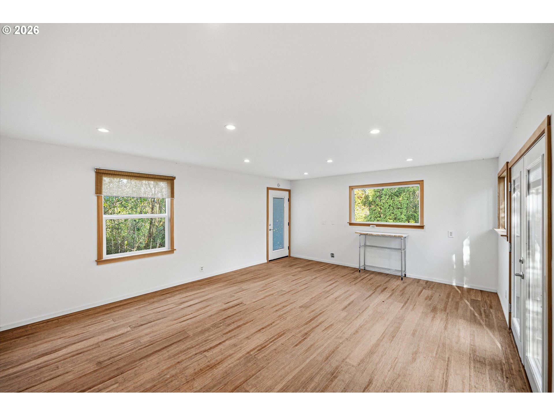 12802 Southeast Knapp Street Portland, OR 97236 - Photo 40 of 48 a view of an empty room with wooden floor and a window