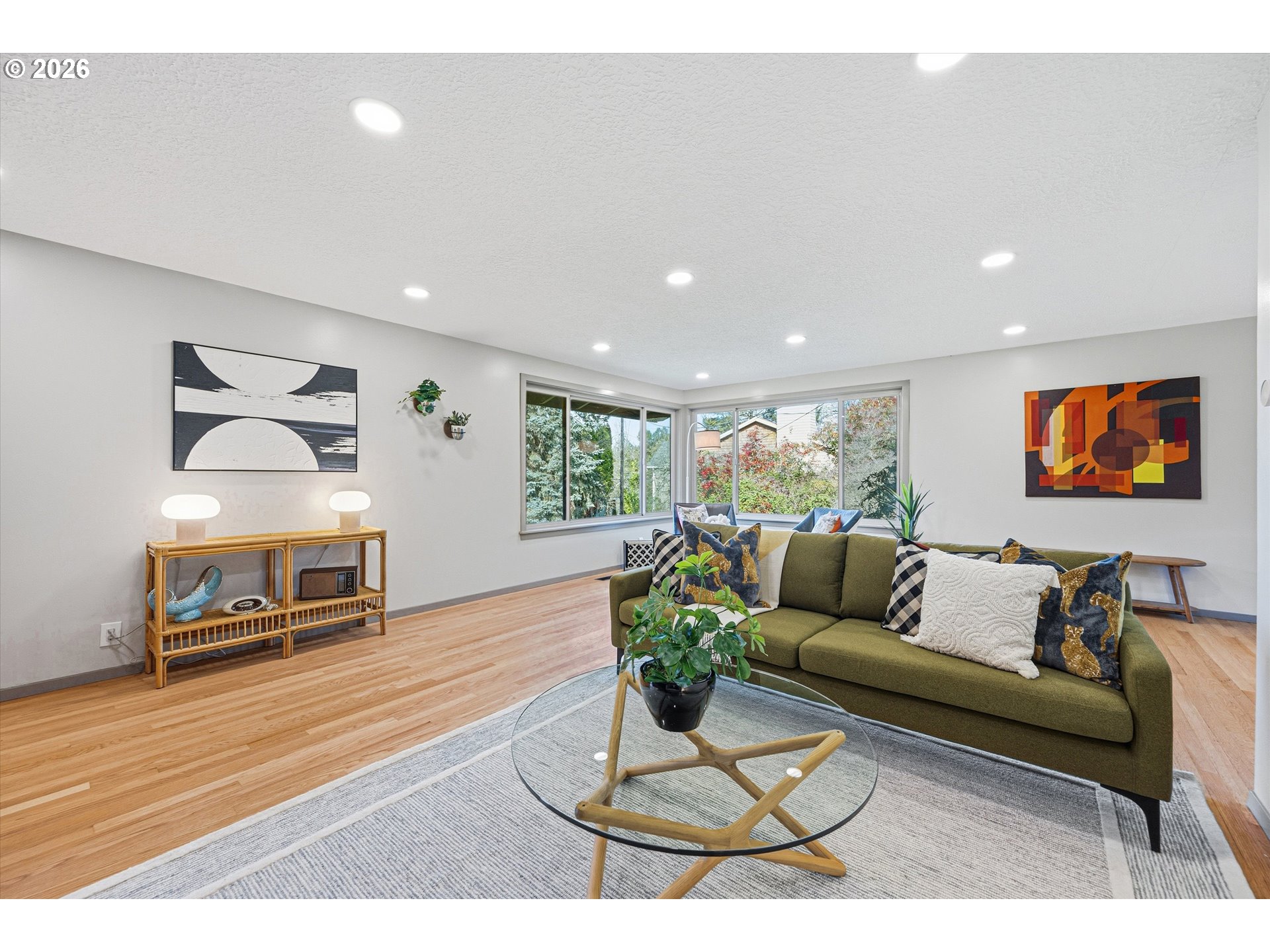 12802 Southeast Knapp Street Portland, OR 97236 - Photo 5 of 48 a living room with furniture a wooden floor and a flat screen tv