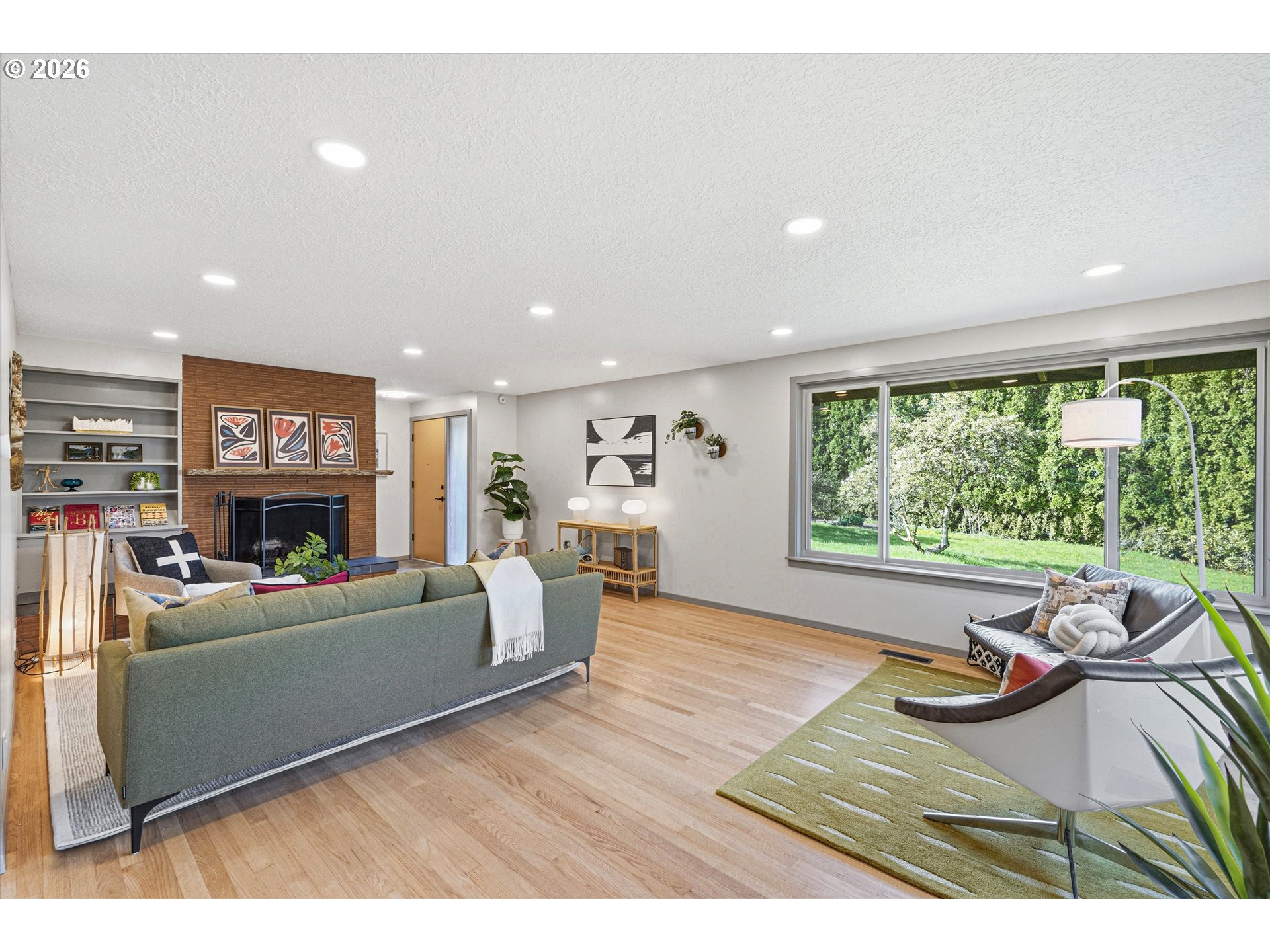 12802 Southeast Knapp Street Portland, OR 97236 - Photo 8 of 48 a living room with furniture and a large window