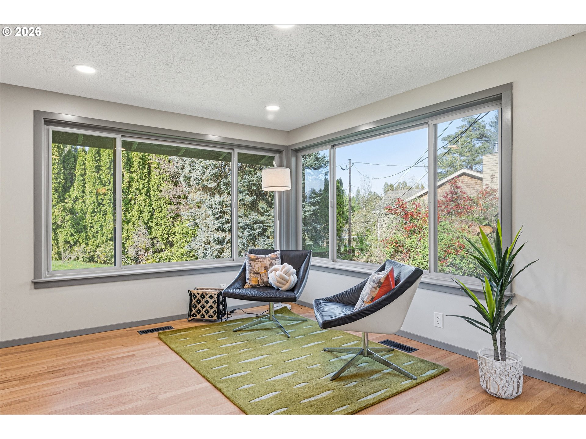 12802 Southeast Knapp Street Portland, OR 97236 - Photo 9 of 48 a living room with a couch and a large window